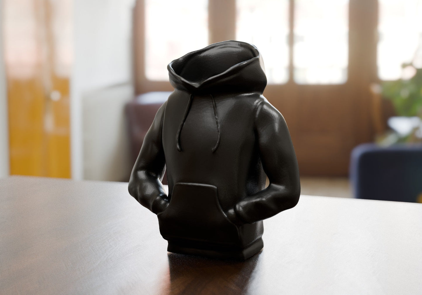 a black toy sitting on top of a wooden table
