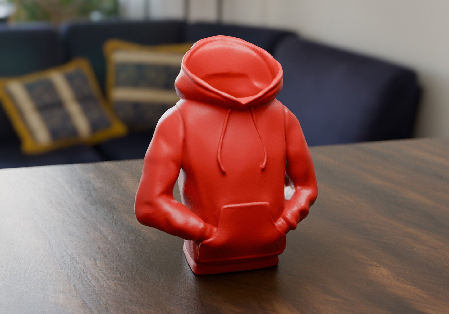 a red toy sitting on top of a wooden table