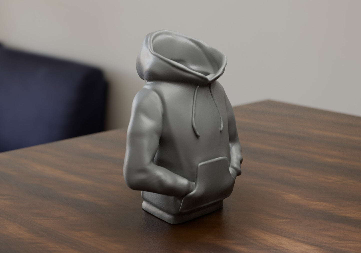 a statue of a person sitting on a table