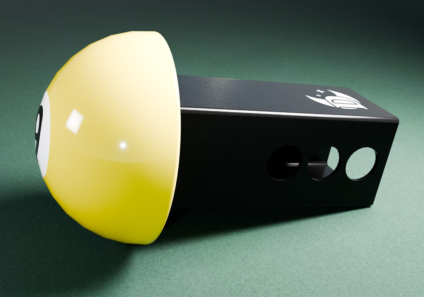 a yellow and black object on a green surface