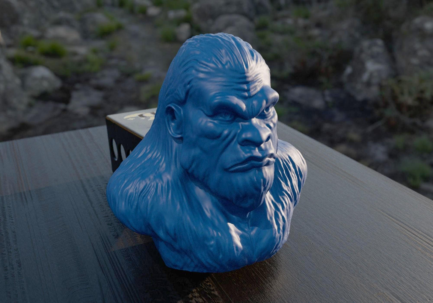 a blue gorilla head sitting on top of a wooden table