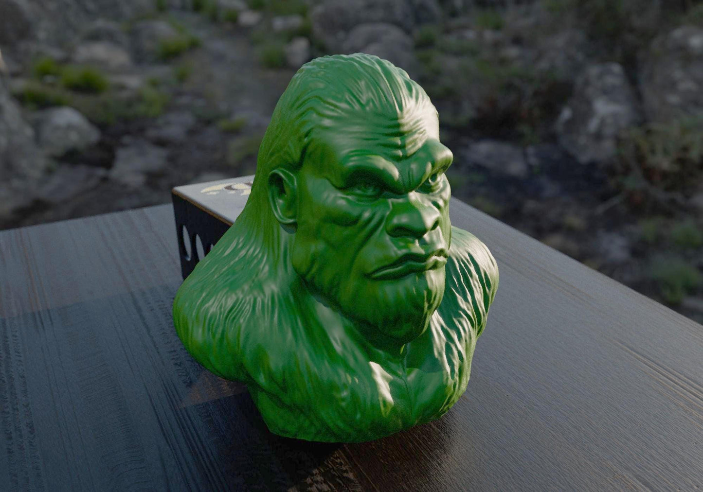a green gorilla head sitting on top of a wooden table