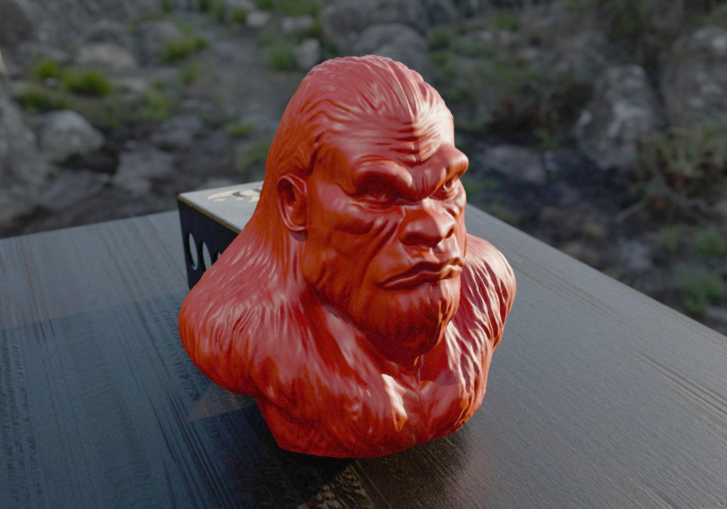 a red gorilla head sitting on top of a wooden table