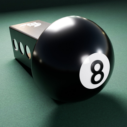 a black pool ball sitting on top of a green table