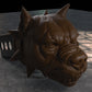 a sculpture of a dog's head on a table