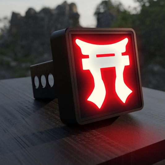 A red neon sign with a white symbol is displayed on a wooden surface, with a blurred natural background.