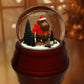 a snow globe with a man inside of it