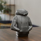 a small toy sitting on top of a wooden table