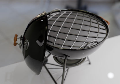 A black metal grill with a grid-like pattern on the grilling surface, placed on a stand.