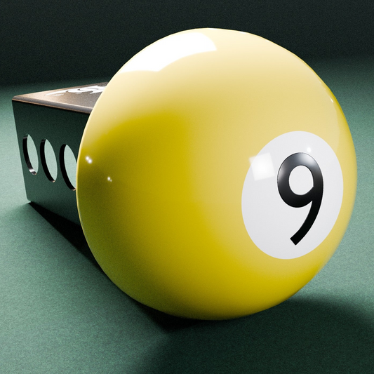 A yellow 9-ball with a black number 9 on it, placed on a green surface.