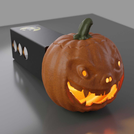 A carved pumpkin with a carved face and glowing orange light is displayed on a dark surface.