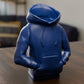 a blue toy sitting on top of a wooden table