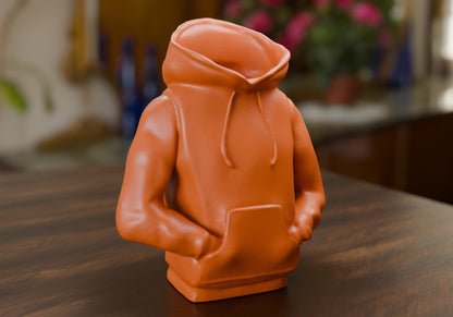 a small orange toy sitting on top of a wooden table