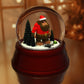 a snow globe with a bear inside of it