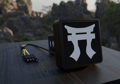 a black and white sign sitting on top of a wooden table