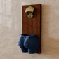 a pair of blue shorts hanging on a wall