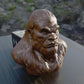 a close up of a statue of a gorilla on a table