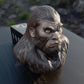 a close up of a monkey head on a table