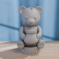 a white bear sitting on top of a wooden table