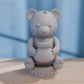a white bear sitting on top of a wooden table