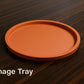 an orange tray sitting on top of a wooden table