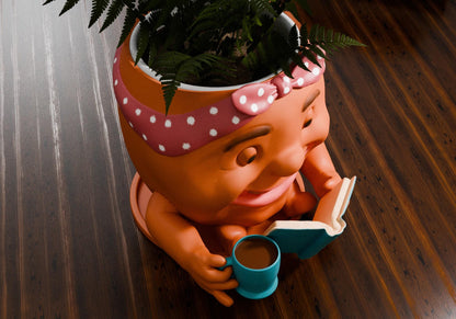 a potted plant with a book and a cup of coffee