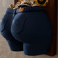 a pair of blue pants hanging on a wall
