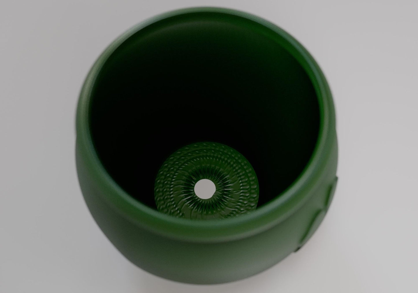 a close up of a green cup on a table