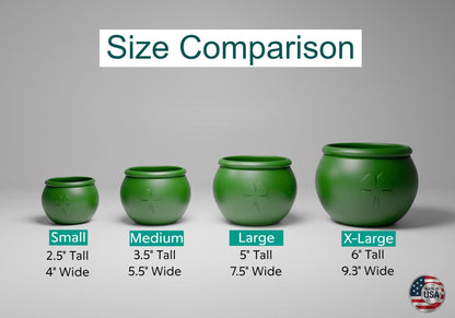 a group of three green vases sitting next to each other