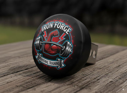 a black bumper sticker with a graphic design of a barbell and a muscular hand, along with the text "Iron-Forge Personal Training".