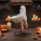 A Halloween-themed scene featuring a ghost figure, carved pumpkins, lit candles, and candy corn on a wooden table.