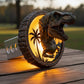 A decorative lamp with a dinosaur head design, illuminated by a warm yellow light, is placed on a wooden surface.