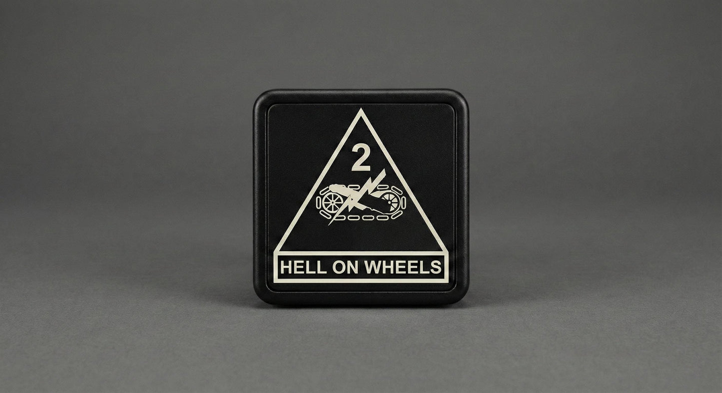 A black square sign with a white triangle and text on it, placed on a gray background.