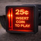 A red sign with the text "25¢ INSERT COIN TO PLAY" illuminated, indicating that a 25-cent coin is required to play a game or purchase a game.