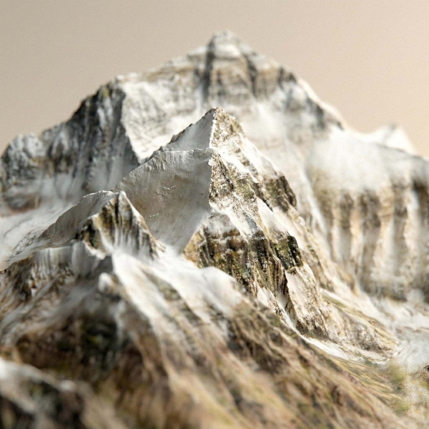 A close-up view of a snow-covered mountain peak, with its jagged and rocky surface covered in a layer of snow.