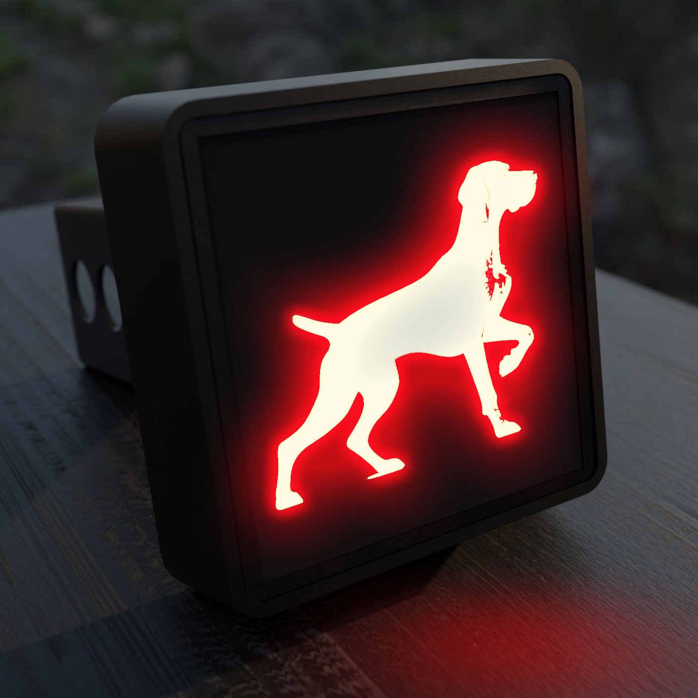 a red dog sign sitting on top of a wooden table